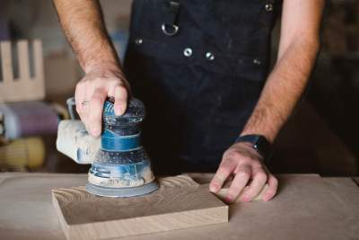 Man using an orbital sander