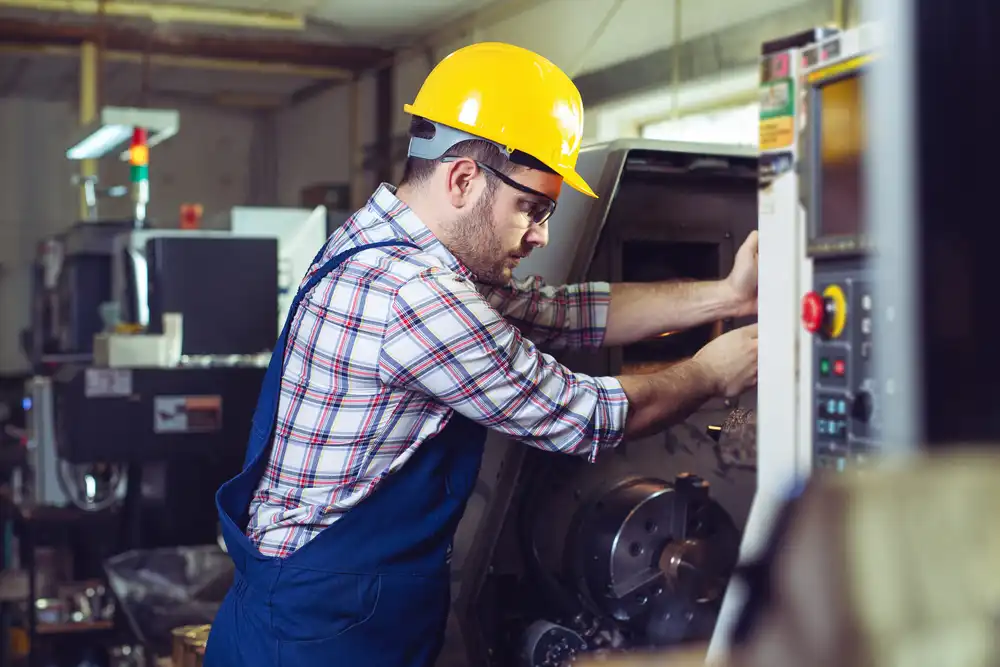 Worker-Change-CNC-Machine-Head.jpg