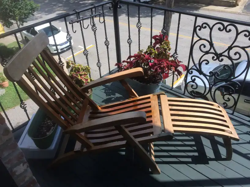 How To Apply Teak Oil The Whittling Guide   Teak Chair With Plants And Balcony View In The Back Ground.webp