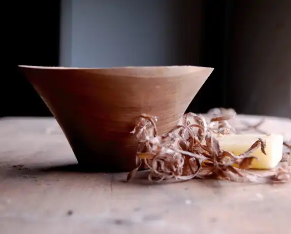 freshly turned wood bowl on a table