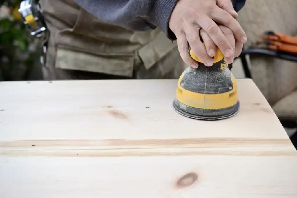 Wood-sanding-with-a-random-orbital-sander