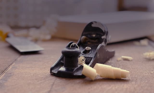 a hand planer on a table