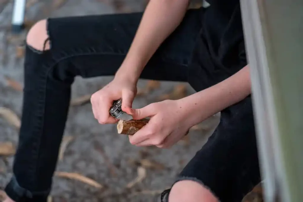 man carving wood 